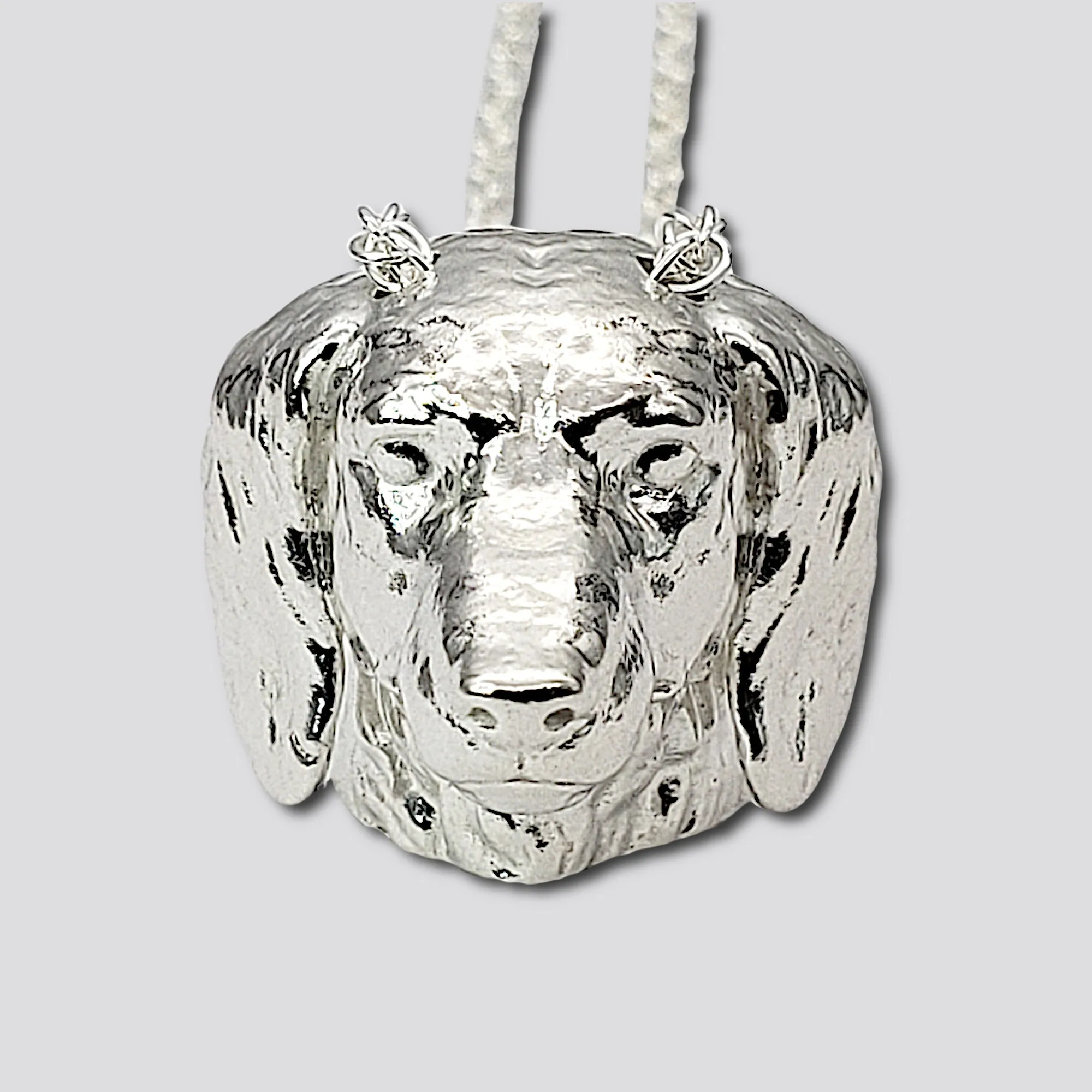 A sterling silver tribute to the  Long-Haired Dachshund