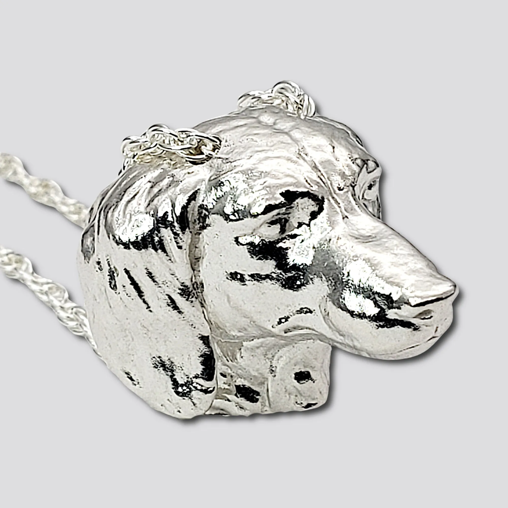 A sterling silver tribute to the  Long-Haired Dachshund