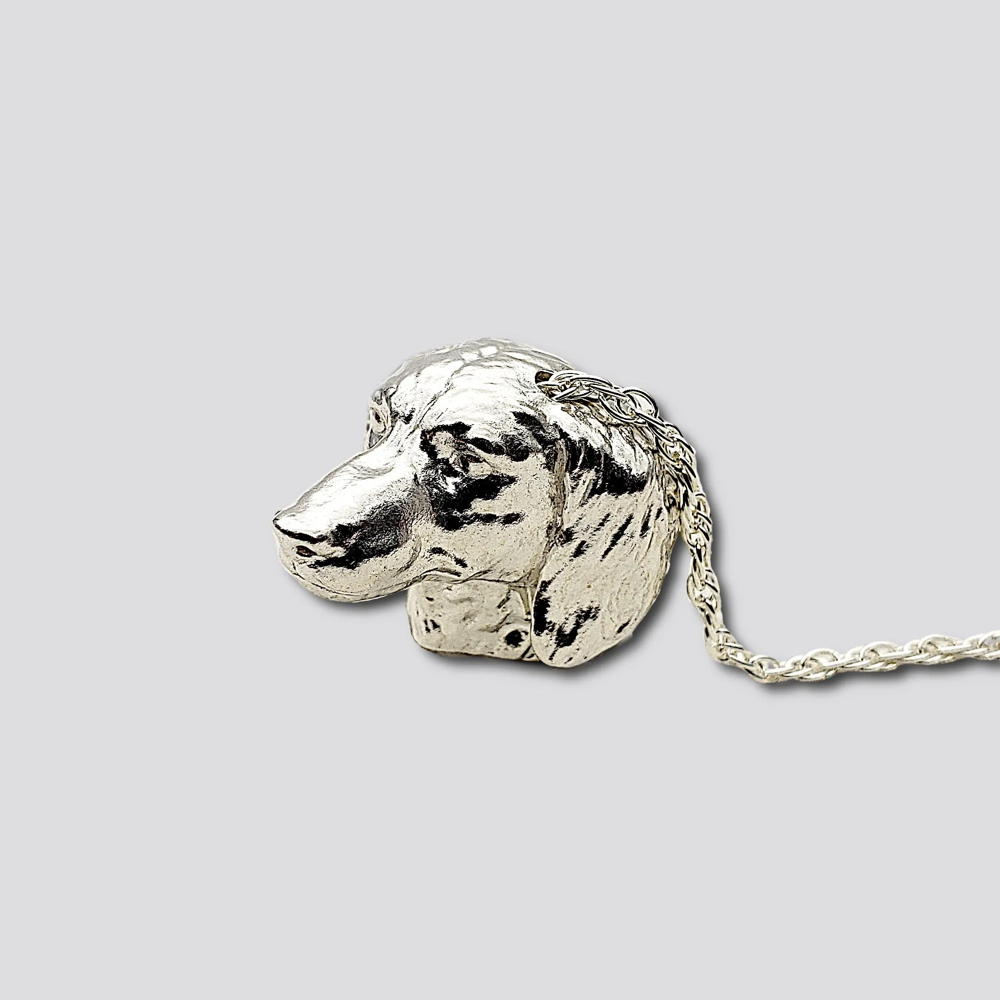 A sterling silver tribute to the  Long-Haired Dachshund