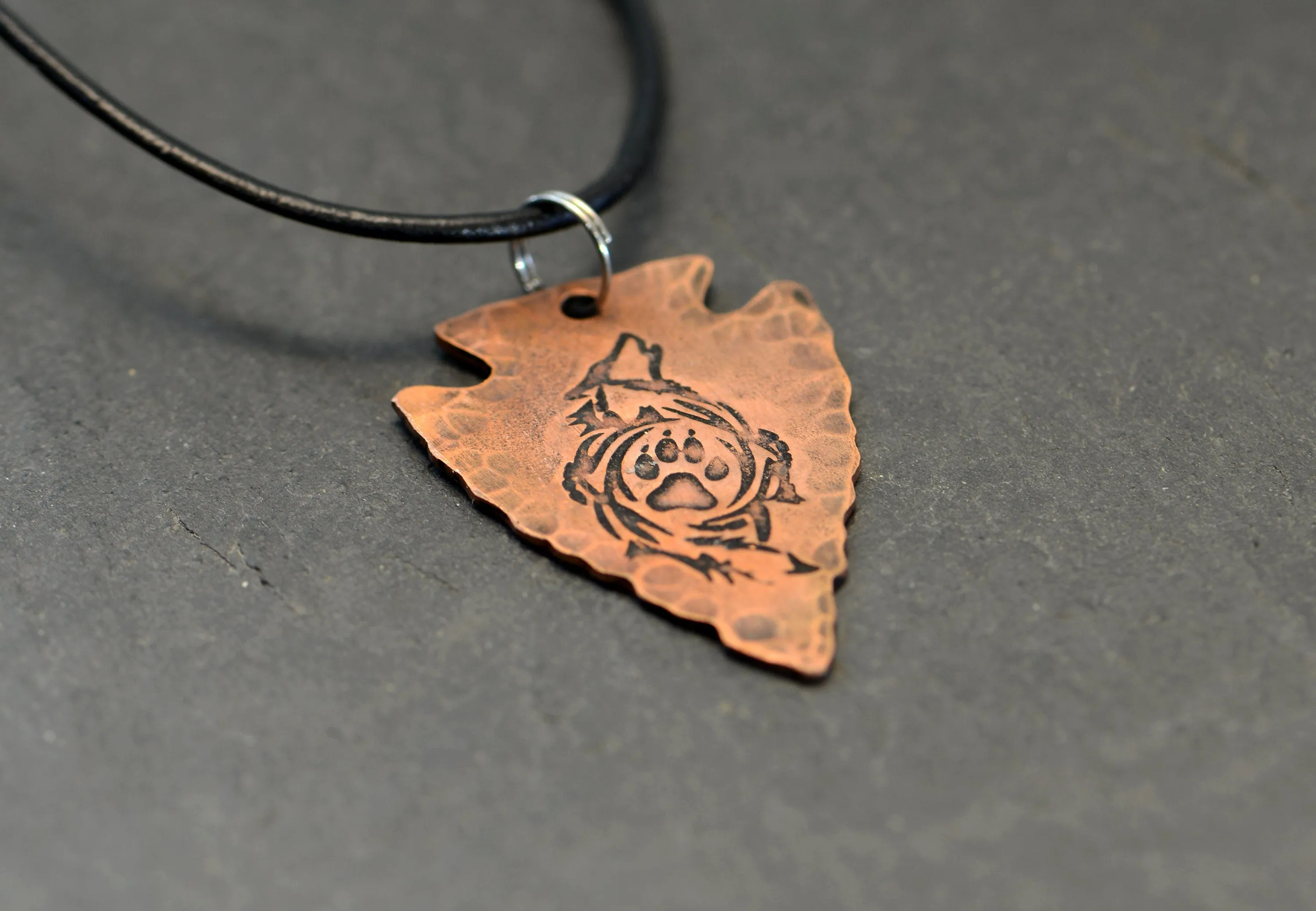Arrowhead copper necklace  with howling wolf and paw
