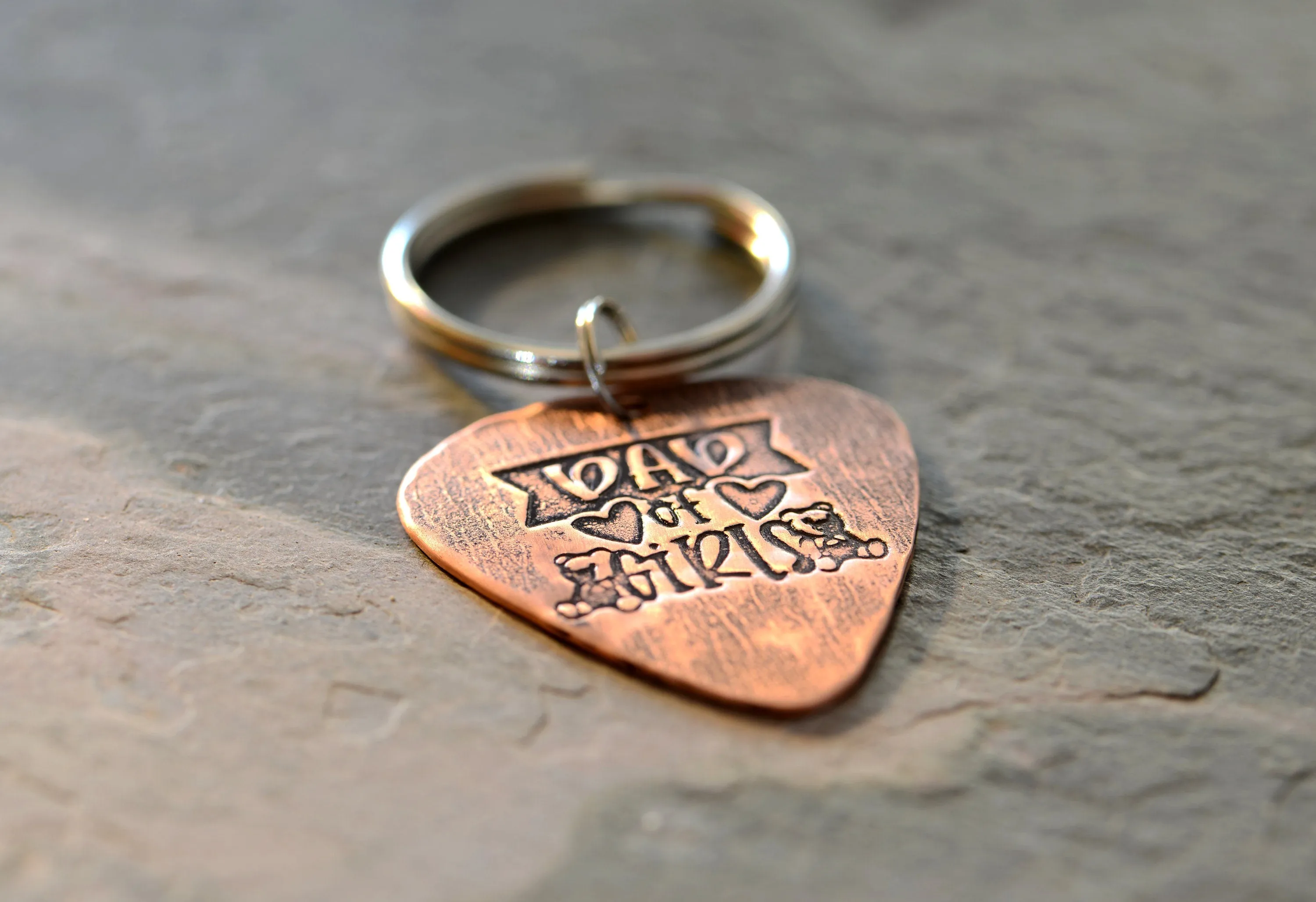 Copper guitar pick keychain stamped with dad of girls