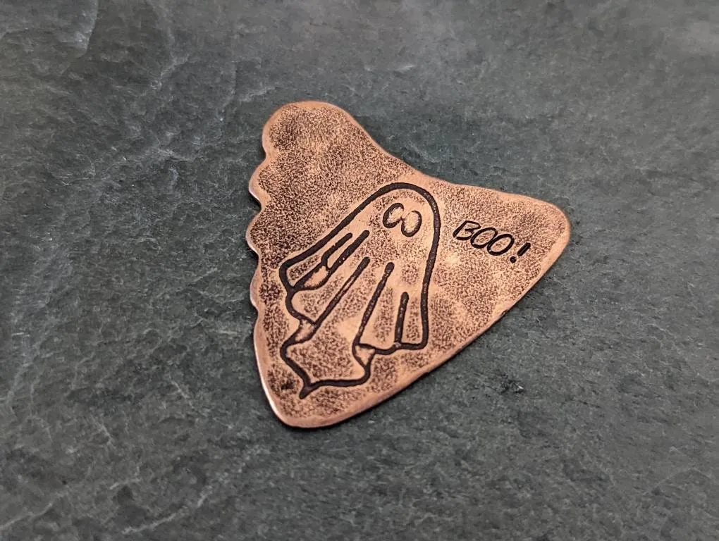 Copper shark tooth guitar pick with ghost and Boo
