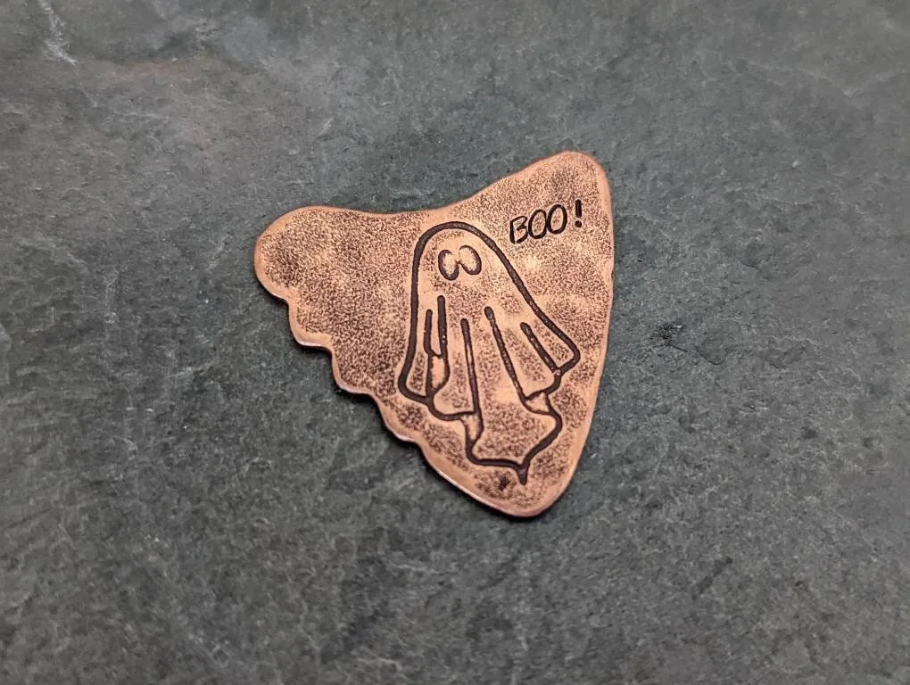 Copper shark tooth guitar pick with ghost and Boo
