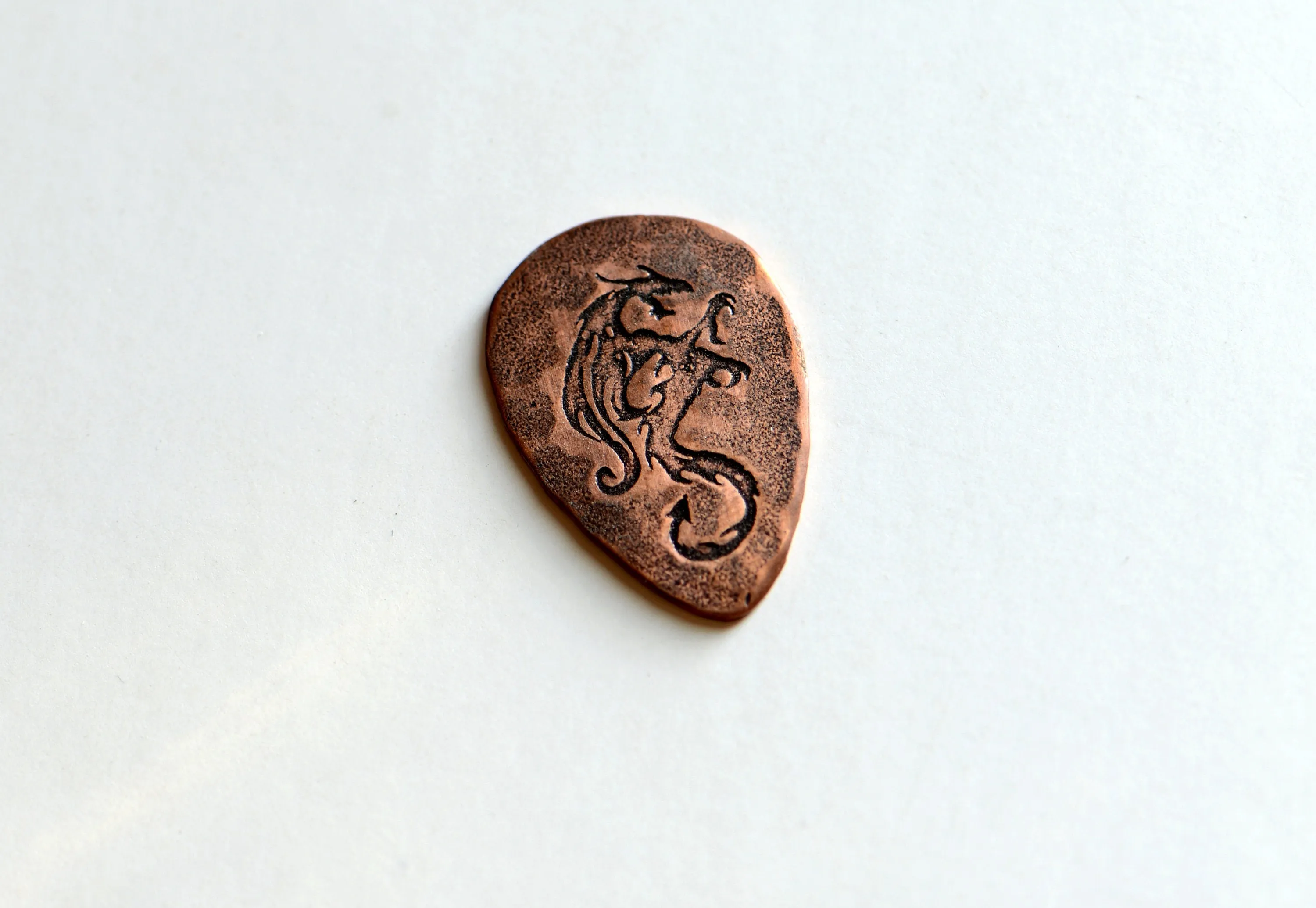 copper tear drop guitar pick with dragon - playable - NicisPicks