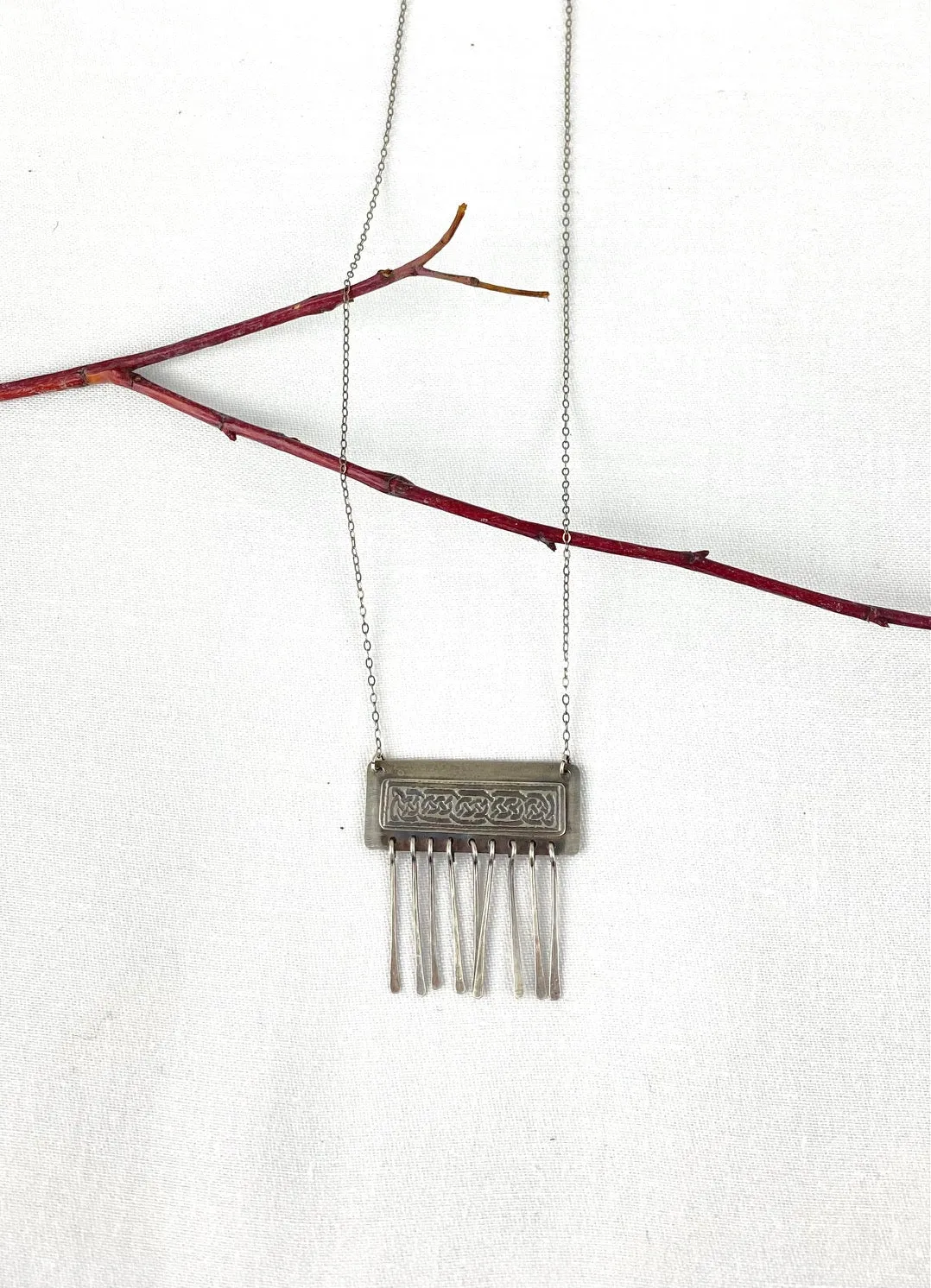 Etched Celtic design on silver necklace