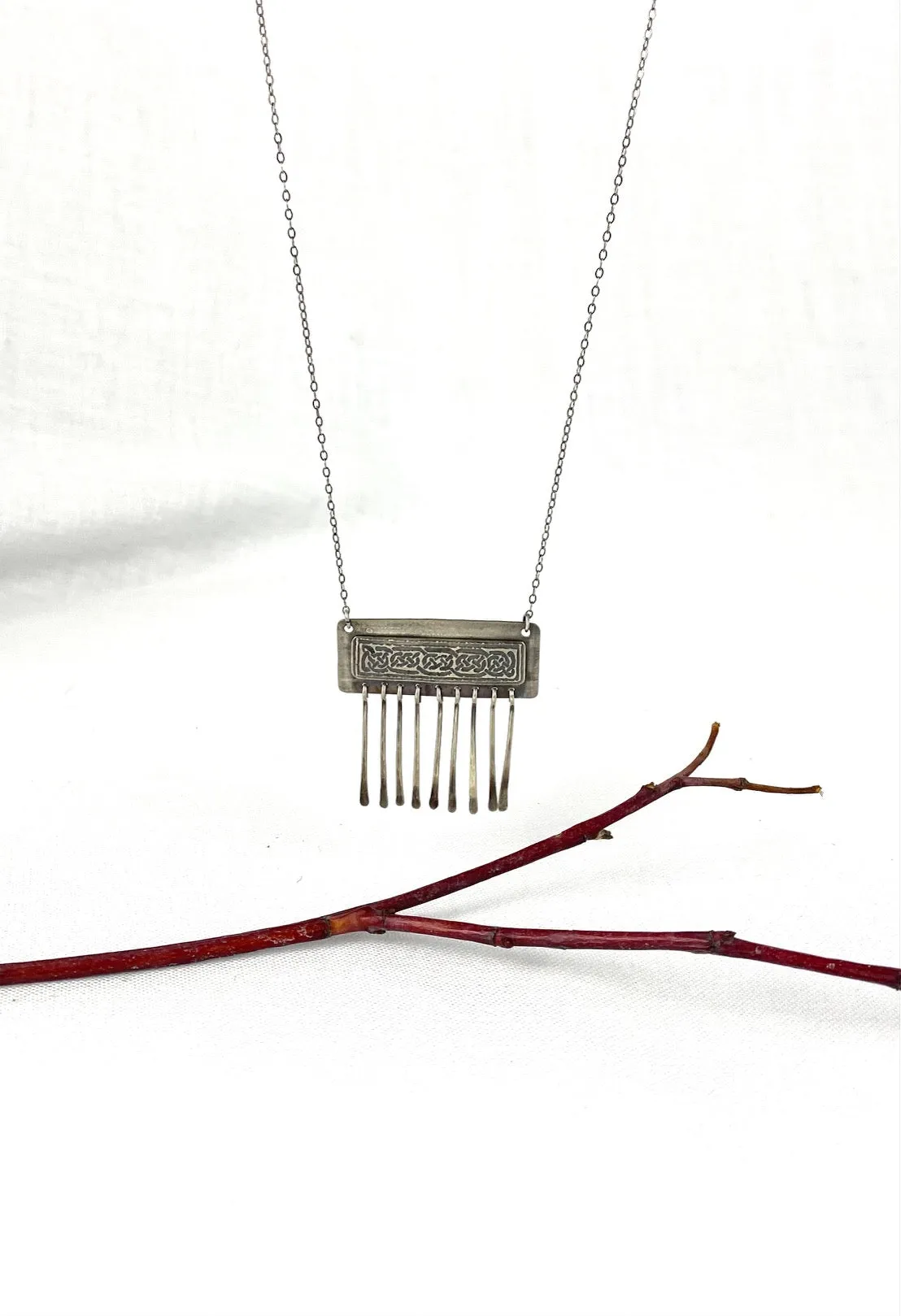 Etched Celtic design on silver necklace