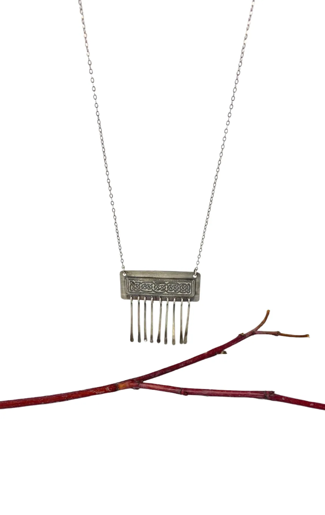 Etched Celtic design on silver necklace