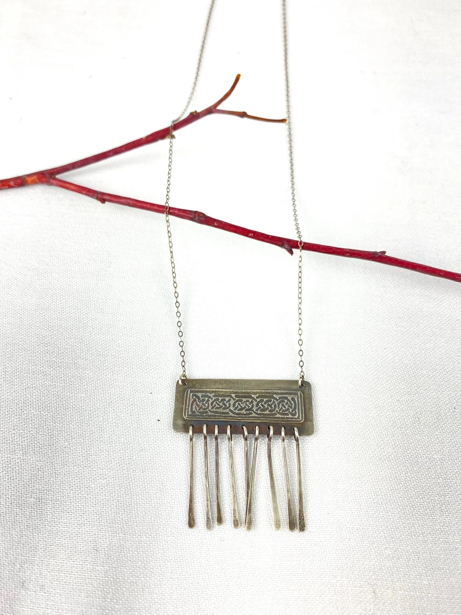 Etched Celtic design on silver necklace