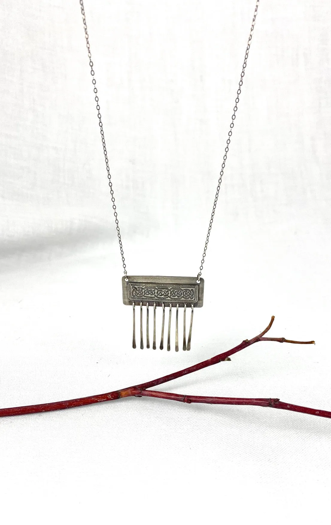 Etched Celtic design on silver necklace