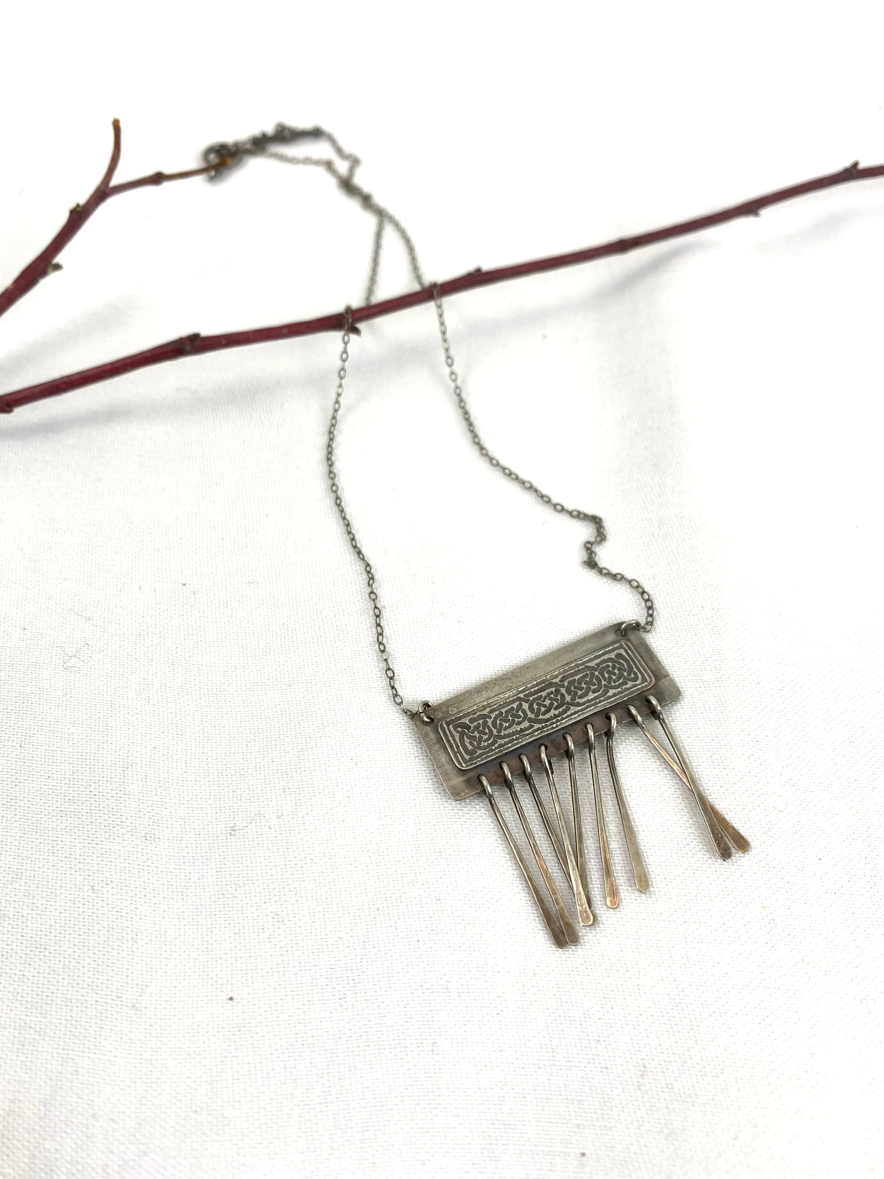 Etched Celtic design on silver necklace
