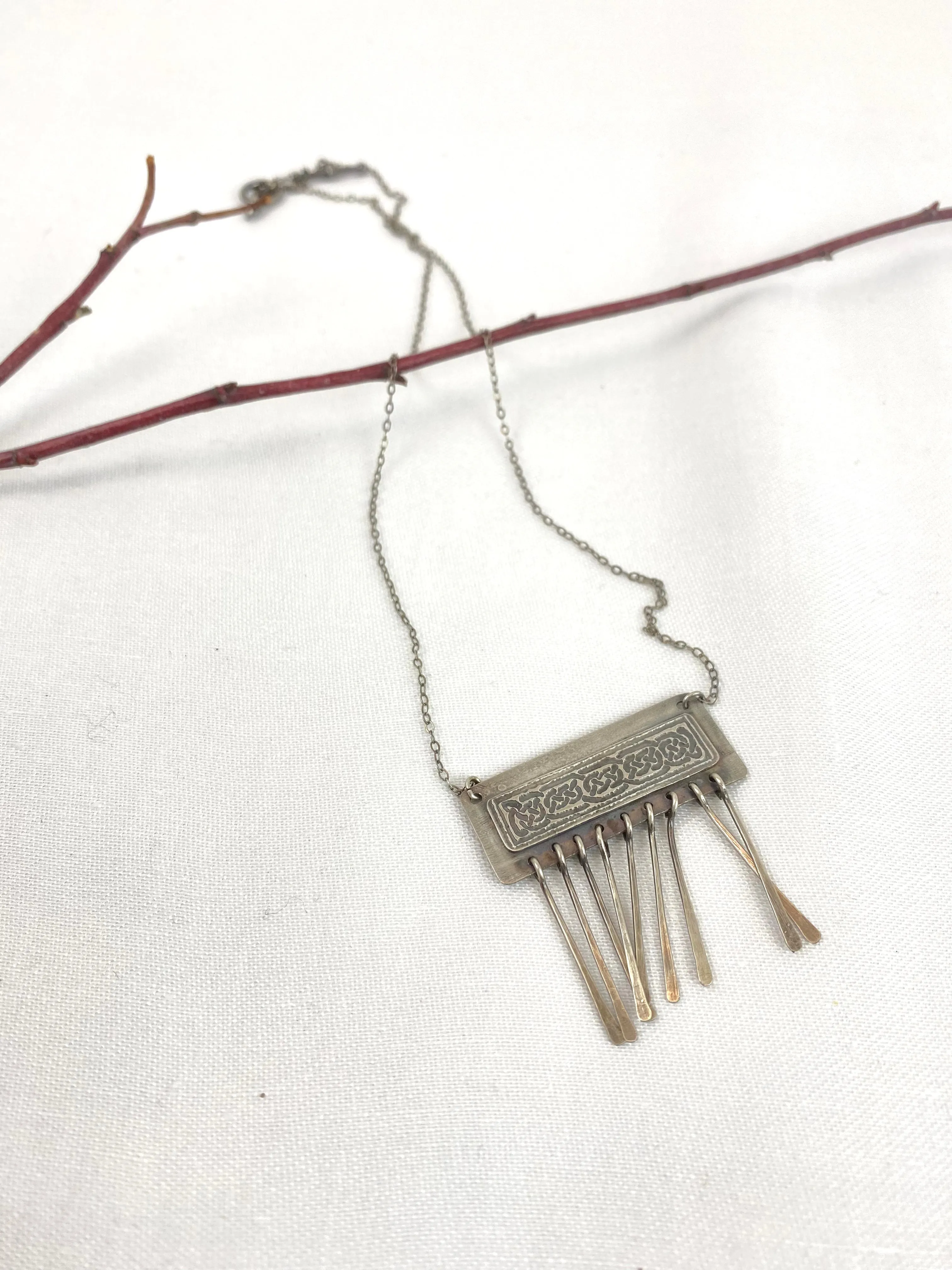 Etched Celtic design on silver necklace