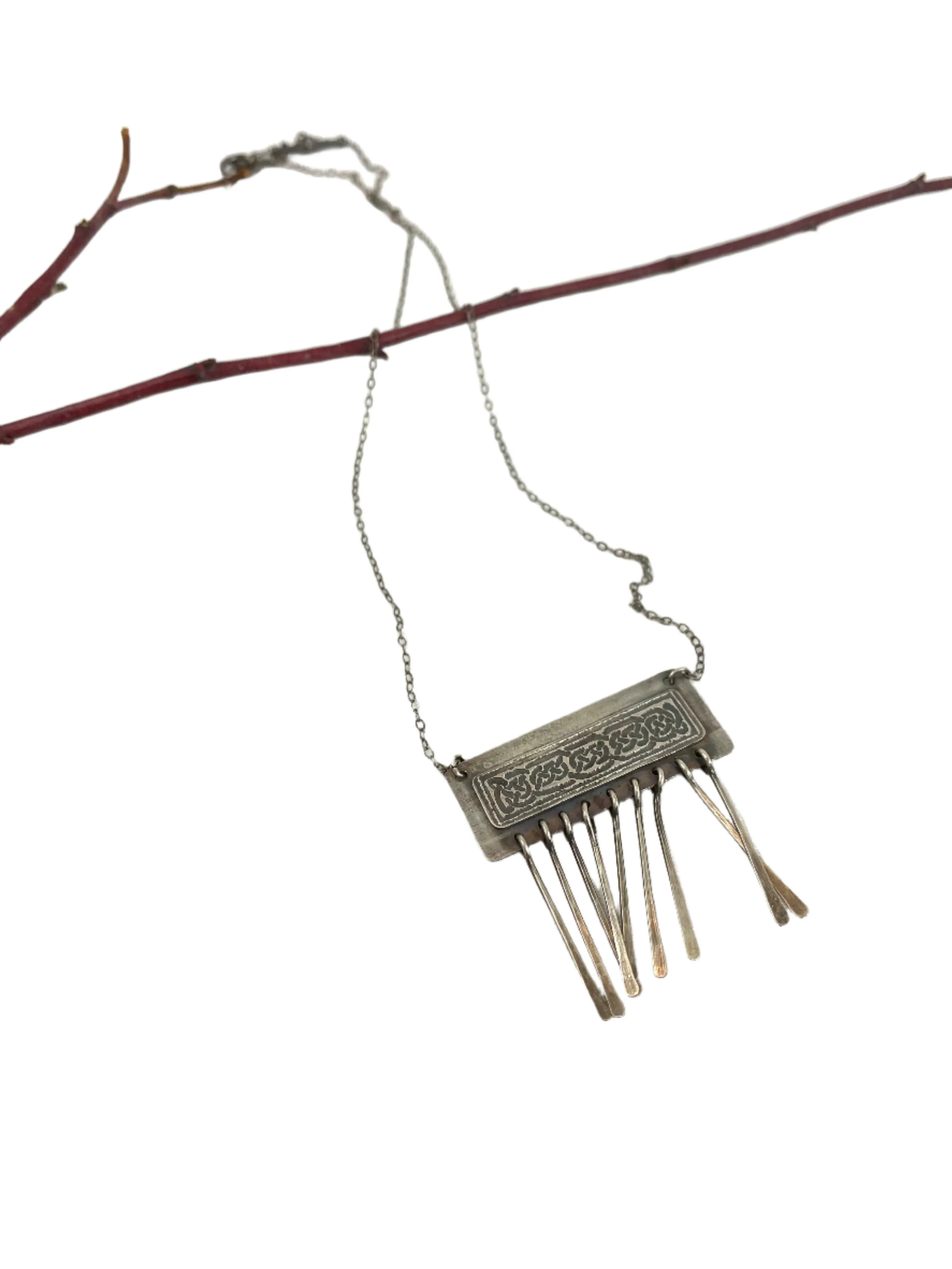 Etched Celtic design on silver necklace