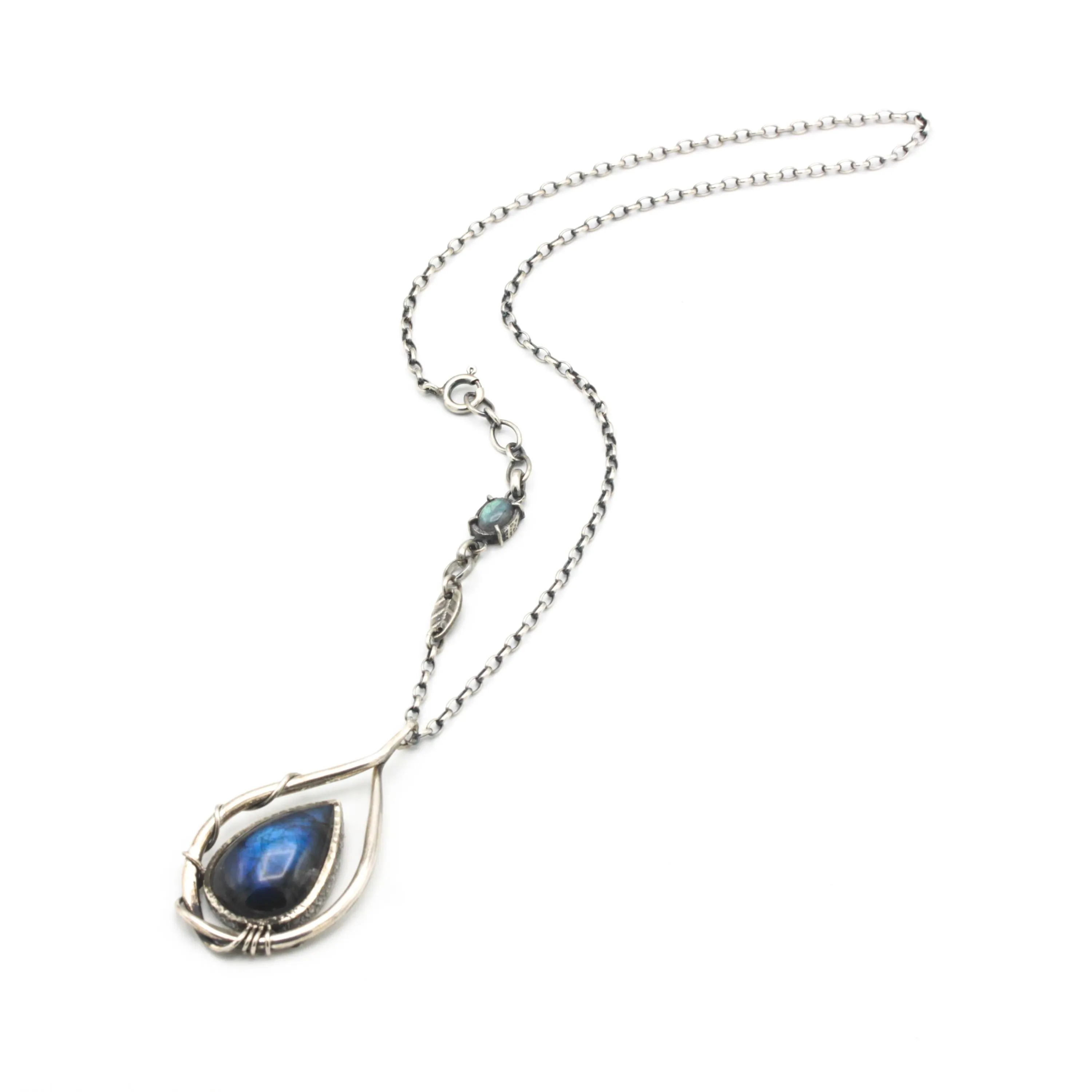 Labradorite teardrop cabochon pendant necklace set in silver bezel setting with a silver vine accent on a sterling silver chain