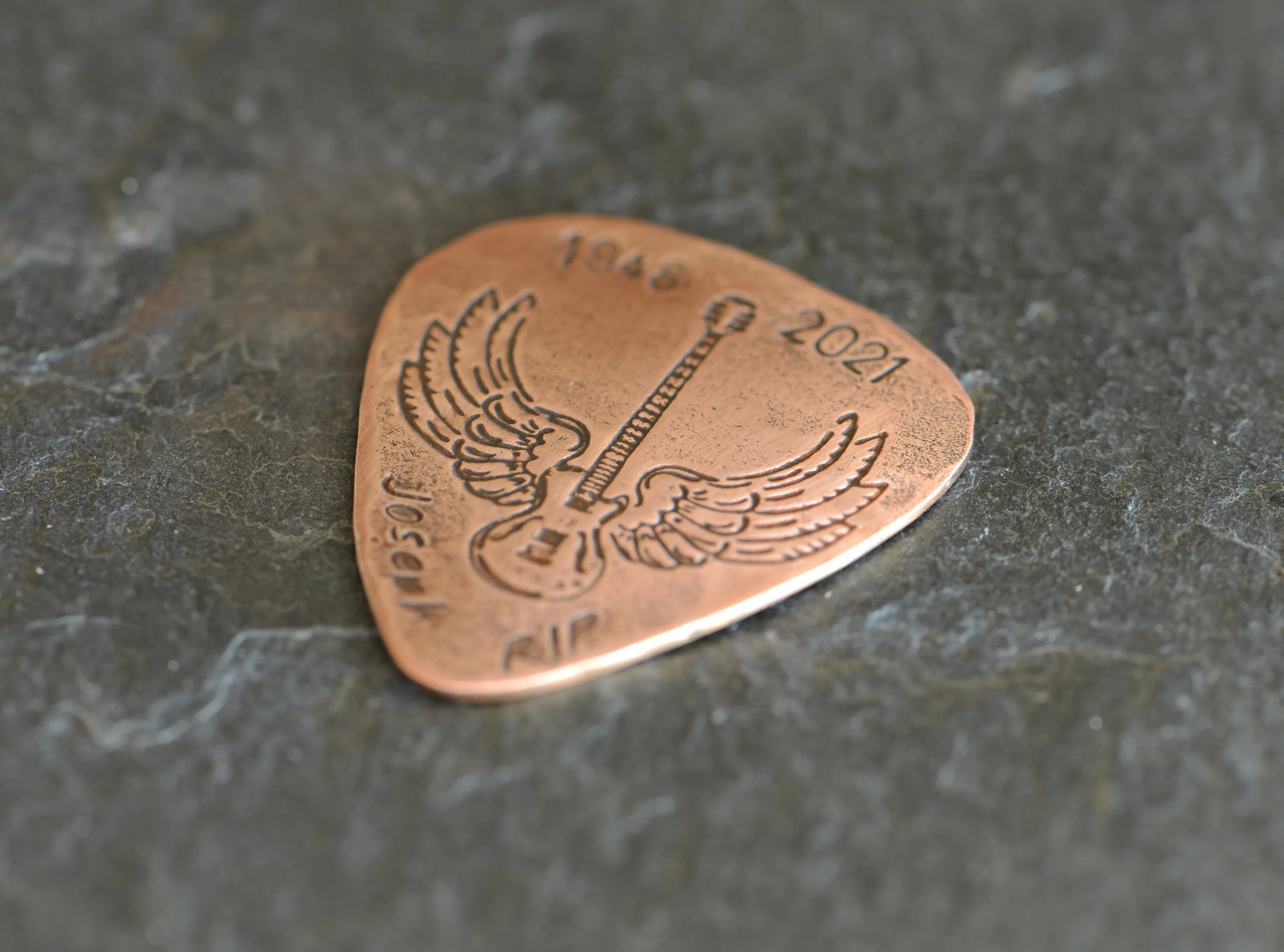 Memorial winged guitar on pick with custom date and name