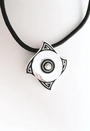 Minimalist, curved diamond shape pendant with a pearl center and fine black enamel work