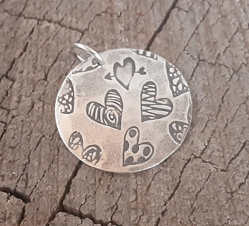 Sterling silver heart charm necklace