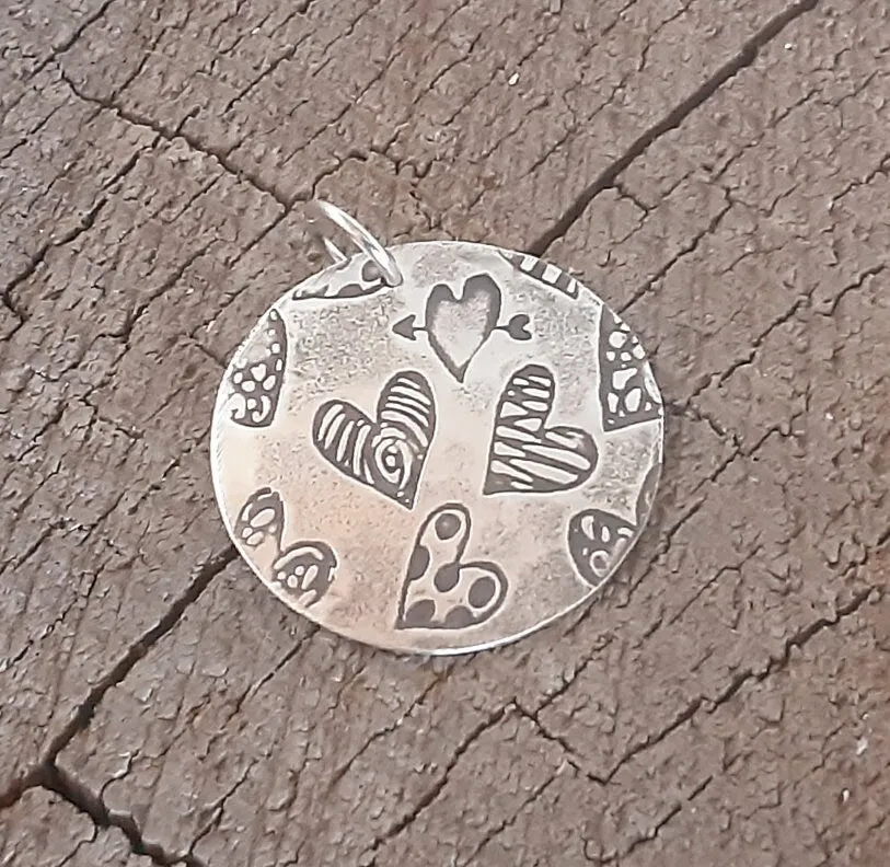 Sterling silver heart charm necklace