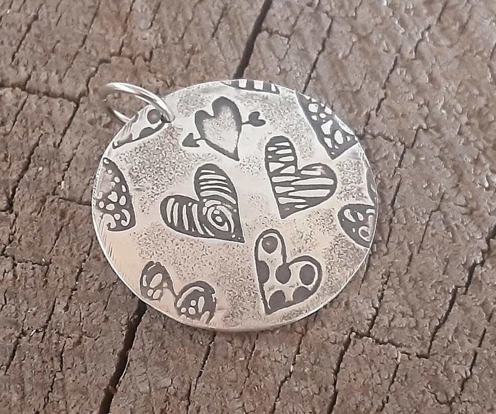Sterling silver heart charm necklace