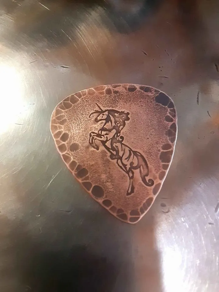 Unicorn and hammered edges copper guitar pick