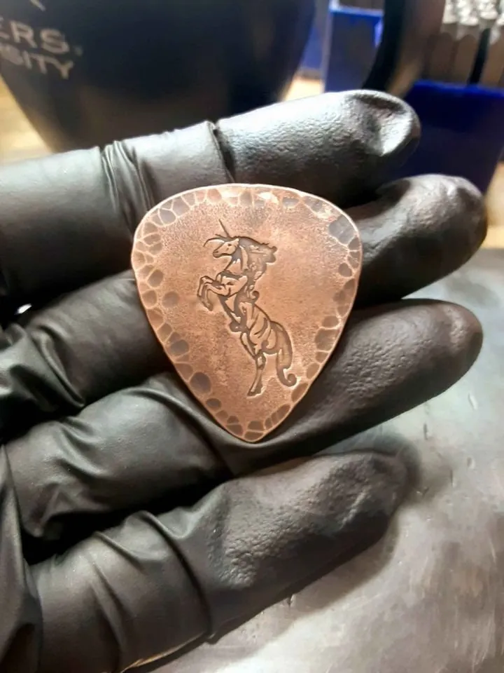 Unicorn and hammered edges copper guitar pick
