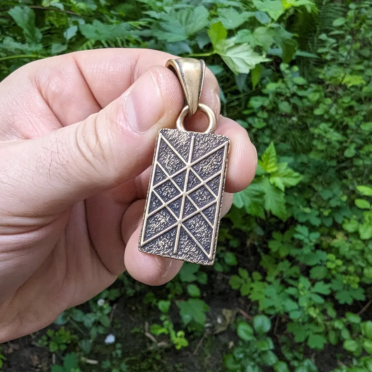 Web of Wyrd bronze pendant